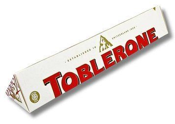 Шоколад белый Toblerone White Chocolane Almond Nougat с медово-миндальной нугой 100 г id_4354 фото